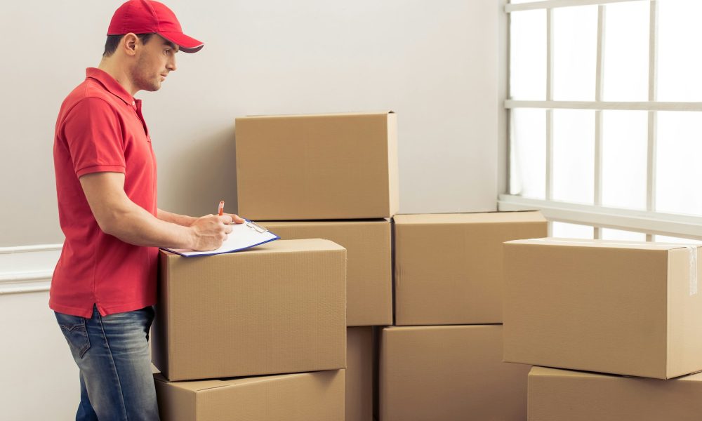 Handsome worker helping to move