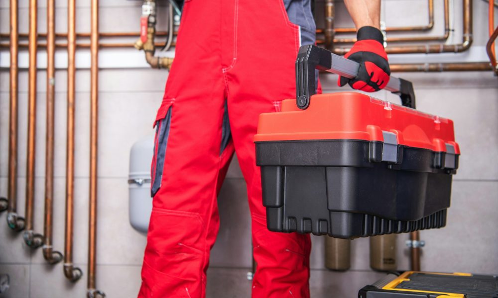 HVAC Warranty Home Call Service Worker with His Tools Box